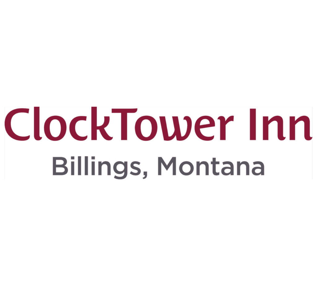 Clock Tower Inn sign with red cursive text on white background, showing the name 'ClockTower Inn' (partial view).